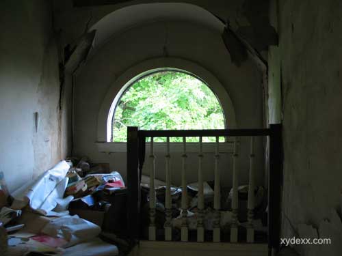 cluttered third floor stairway
