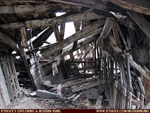 Interior view inside the collapsed dairy barn