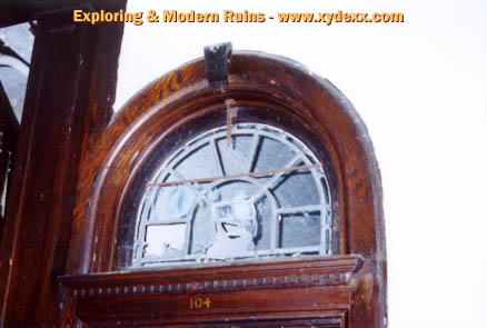 A window above the door to Room 104